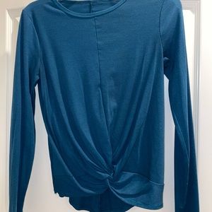 Blue long sleeve workout top with knot in front